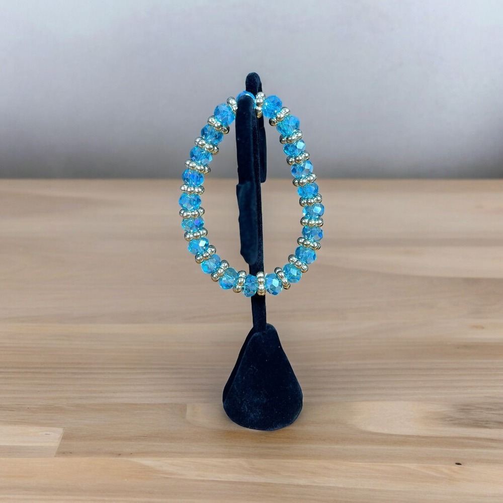 Light blue‎ color glass beaded stretch bracelet with Gold Beaded Spacers